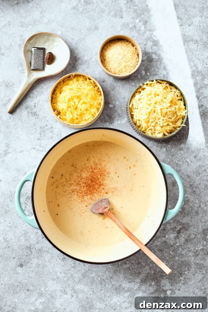 The nutmeg is stirred into the roux.