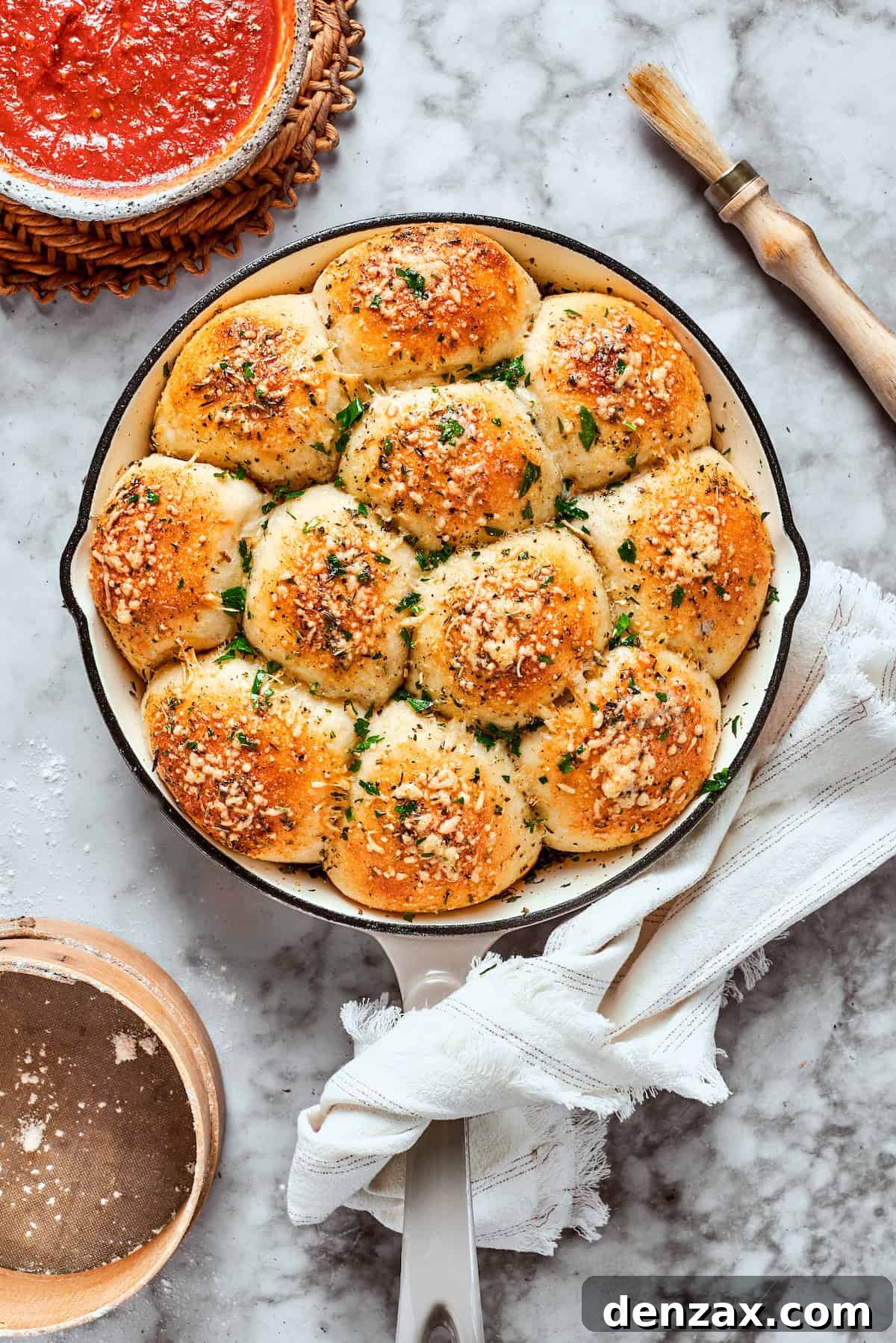 Freshly baked pizza bites, golden brown and crispy, showcasing melted cheese and pepperoni, presented in a rustic skillet.