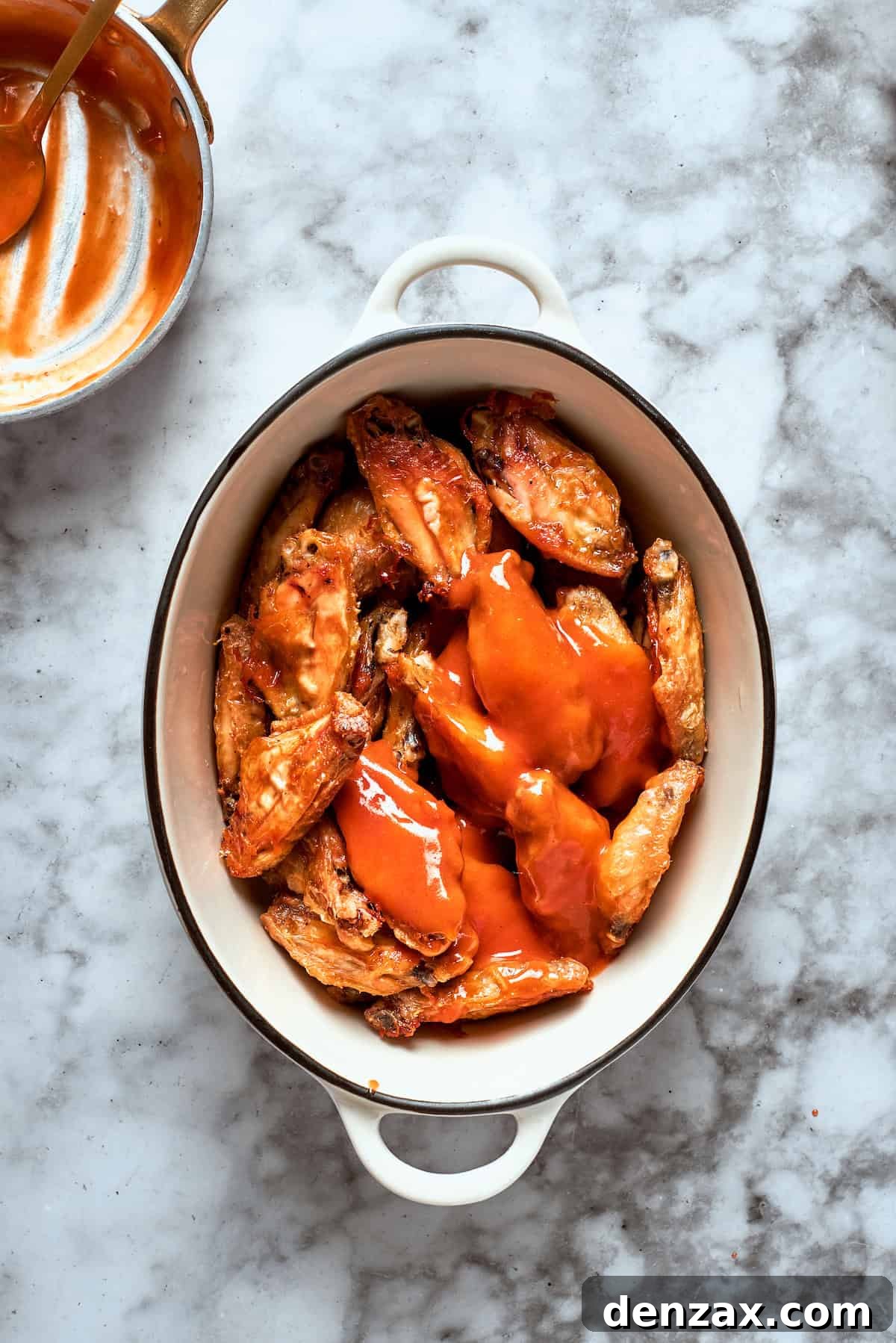 The wings are topped with sauce.