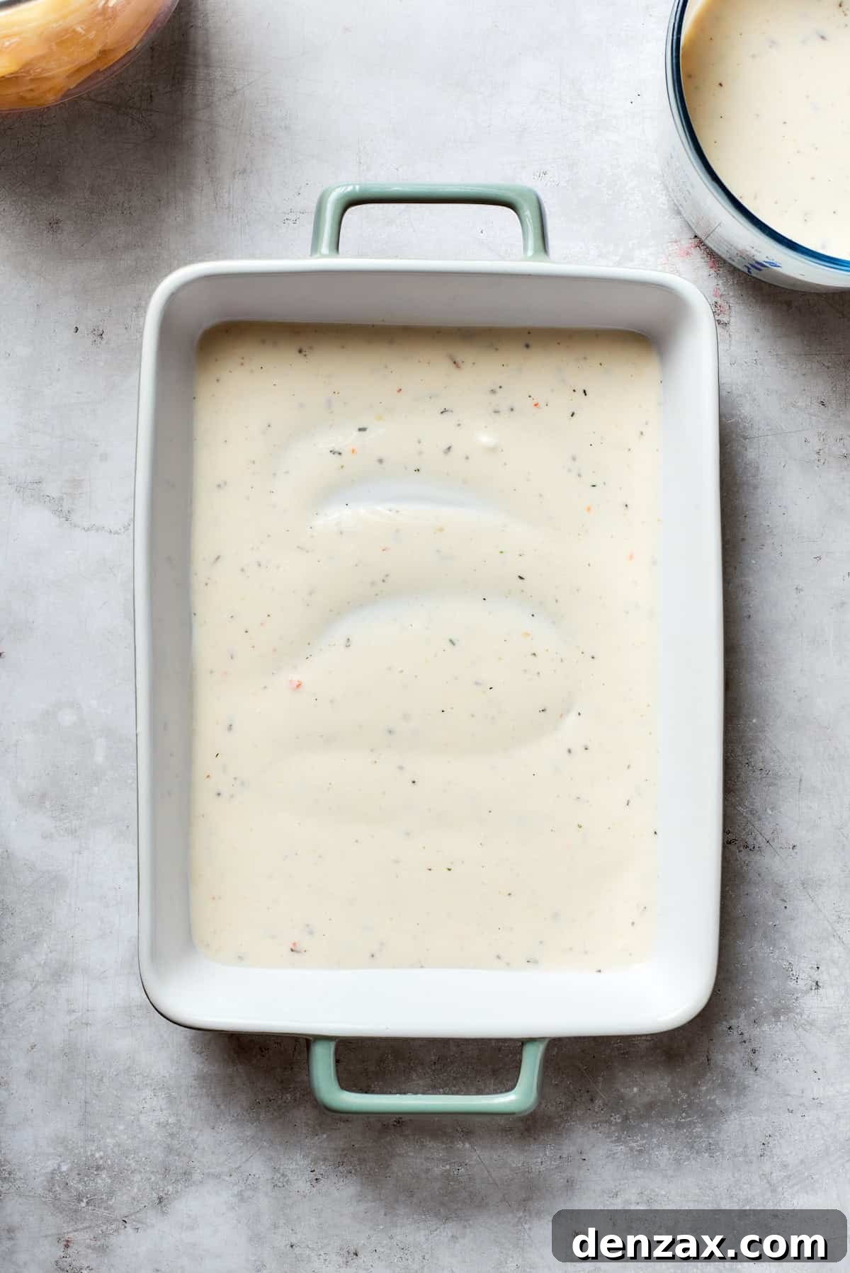 Mushroom soup is added to the bottom of the pan.