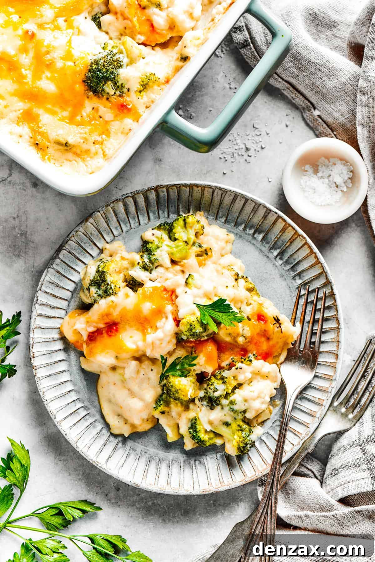 A serving of broccoli rice casserole served on a dinner plate.