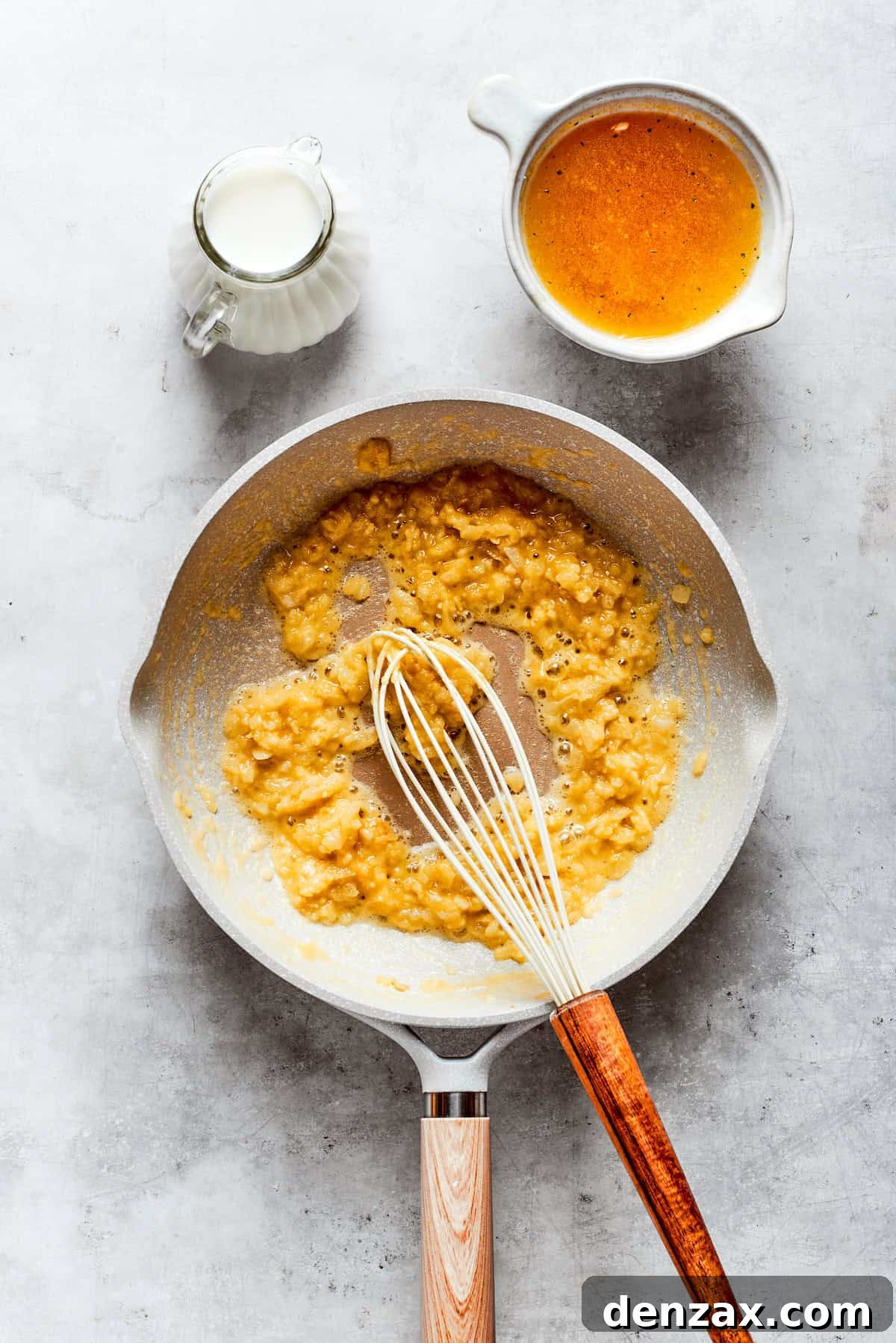 Cheddar cheese is whisked into a roux.