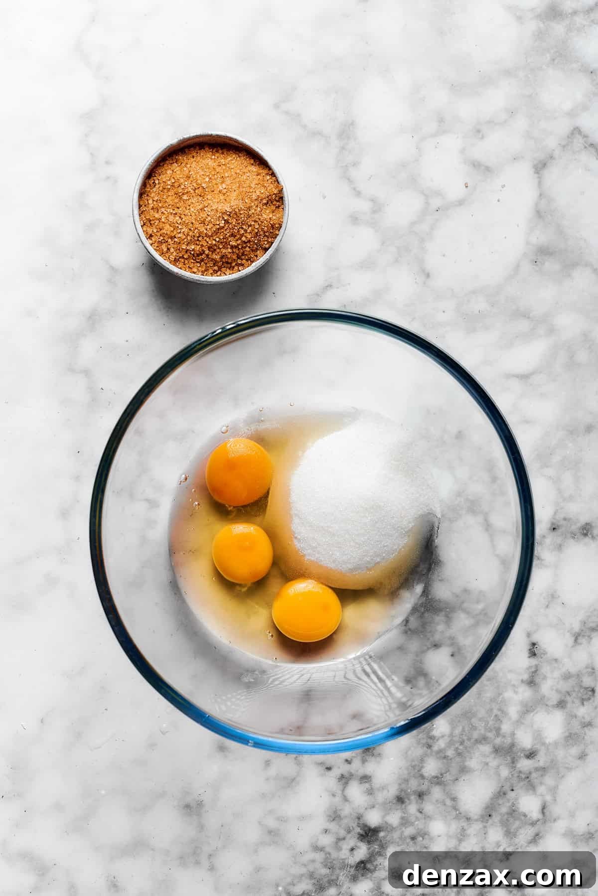 Eggs, granulated sugar, and brown sugar are creamed together in a separate bowl until smooth and well-combined.