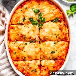 Overhead image of baked million dollar spaghetti in a casserole dish.
