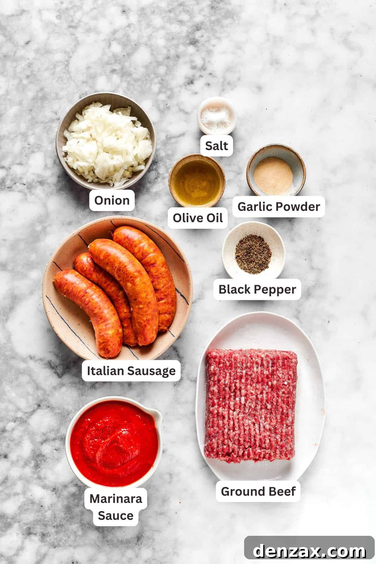 A selection of fresh ingredients for million dollar spaghetti, including various cheeses, meat, and pasta.