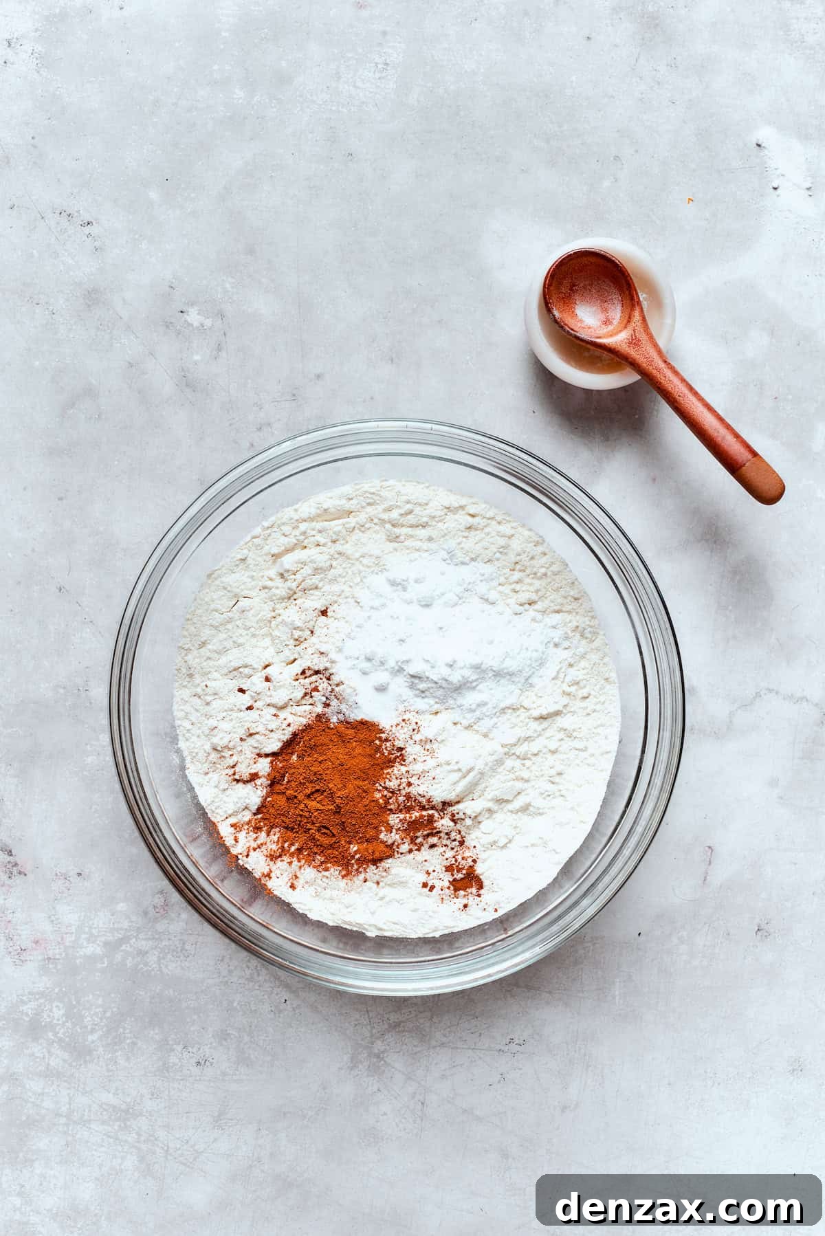 A separate bowl holding all the dry ingredients – flour, spices, leavening agents – perfectly combined before being added to the wet mixture.