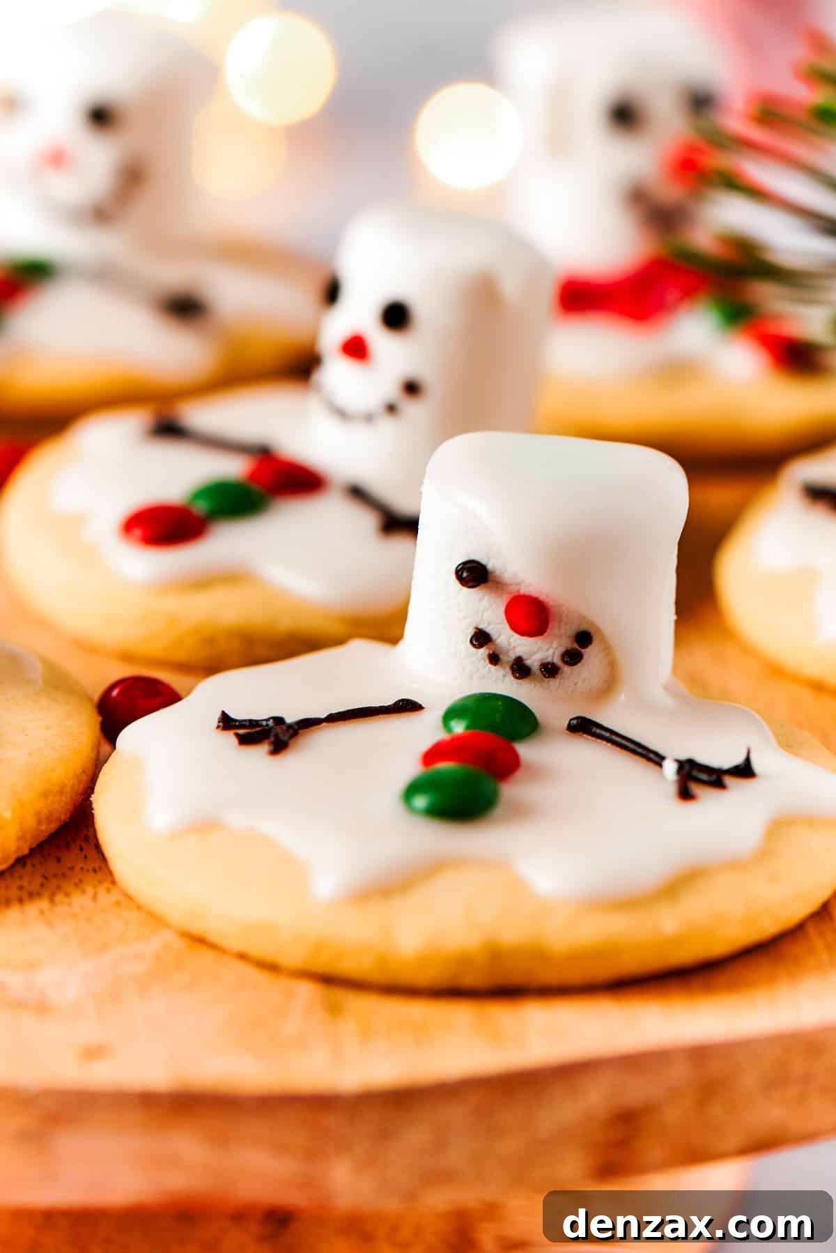 The cutest Melted Snowman Cookies top buttery homemade sugar cookies with a thick vanilla frosting and a fluffy marshmallow! Close-up of a melted snowman cookie, highlighting its intricate details and delicious frosting.