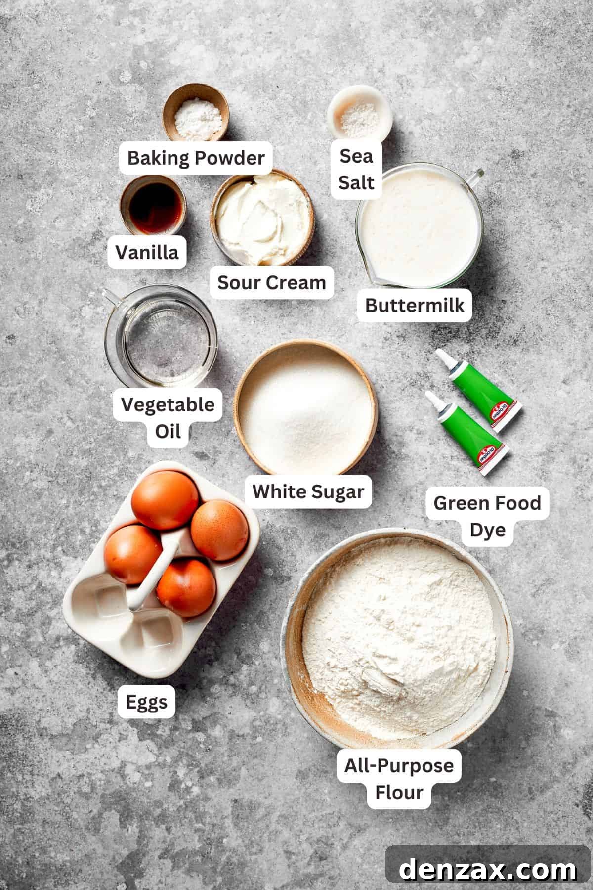 Grinch Cake Ingredients: Essential Components for a Festive Holiday Dessert Ingredients to make a grinch cake are clearly labeled and neatly arranged on a counter.