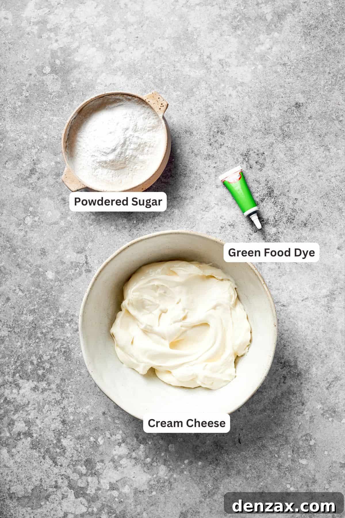 Green Cream Cheese Frosting Ingredients for Grinch Cake The frosting ingredients for grinch cake are labeled, including cream cheese, powdered sugar, and green food coloring.