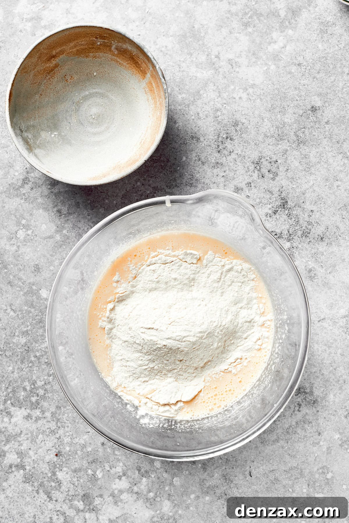 Fold Dry Ingredients into Grinch Cake Batter for a Perfect Blend Dry ingredients are carefully folded into the wet batter for the grinch cake, maintaining a light consistency.