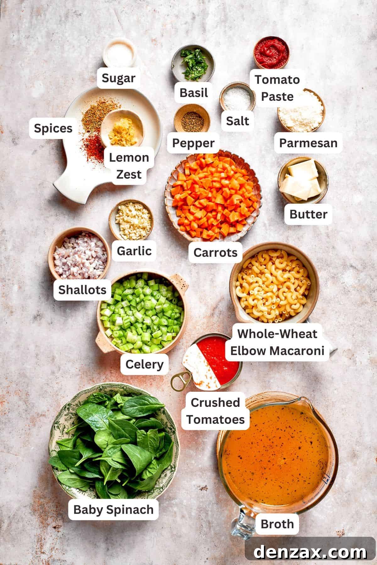 Fresh, high-quality ingredients for Tomato Florentine Soup laid out on a wooden board, including tomatoes, spinach, herbs, and pasta.