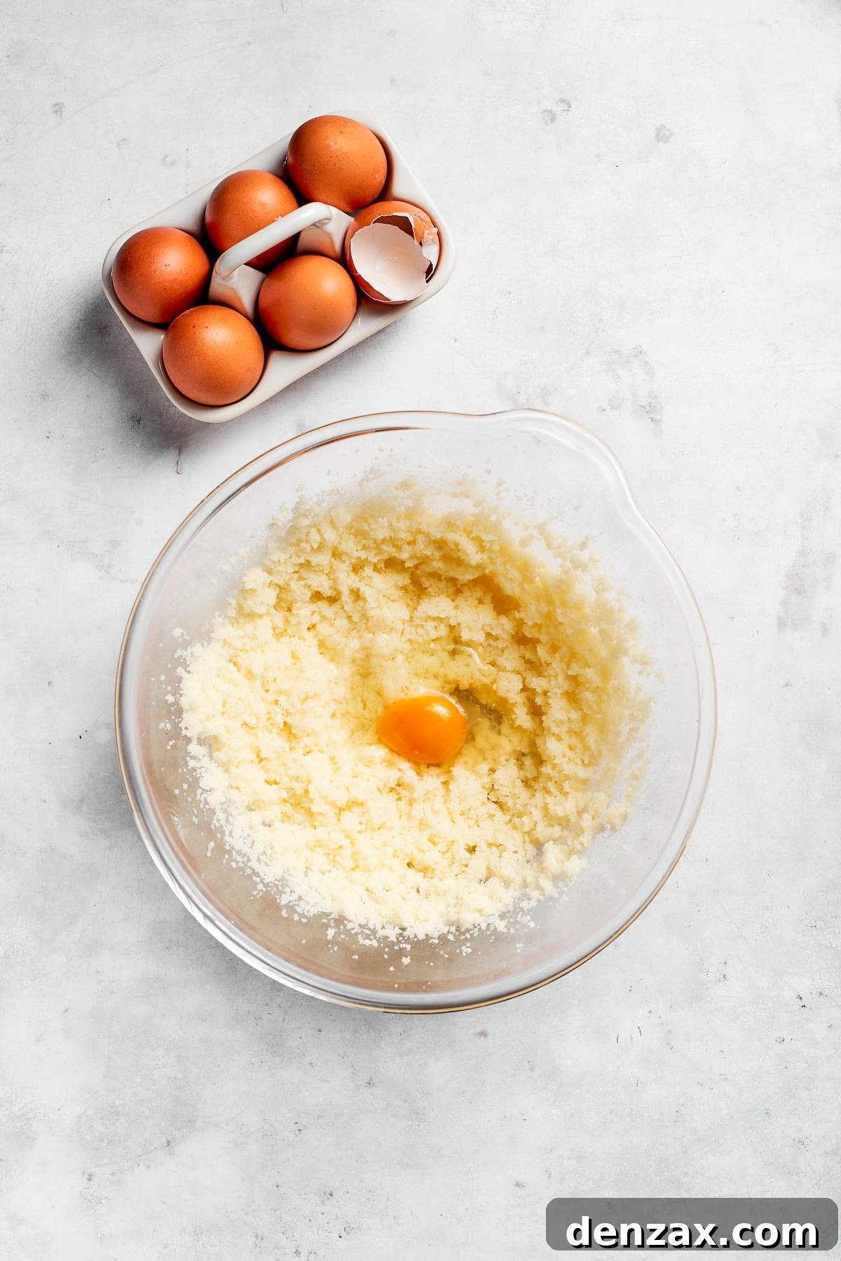 Eggs are added to creamed butter and sugar.