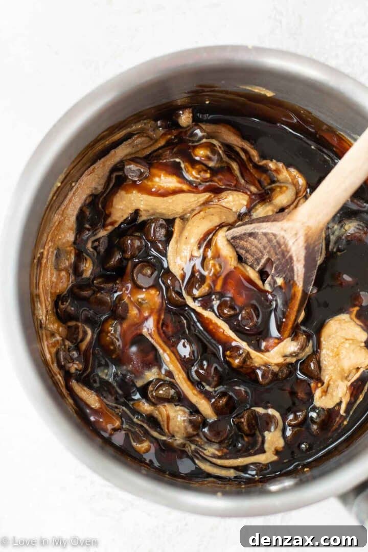 Melting chocolate, date syrup, and peanut butter