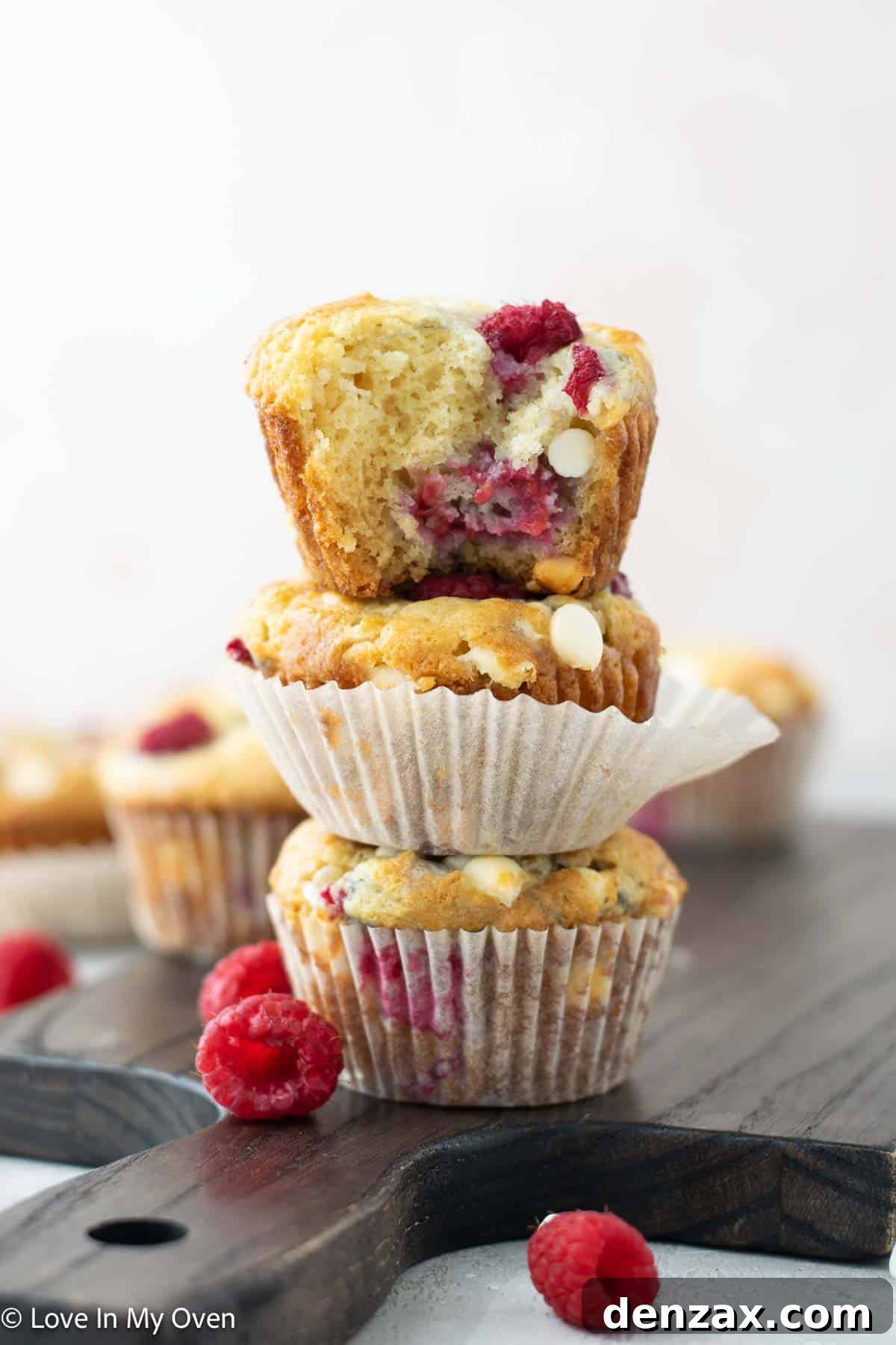 Sweet Raspberry White Chocolate Delights 2 Delicious Raspberry White Chocolate Muffins, perfectly baked and ready to eat.