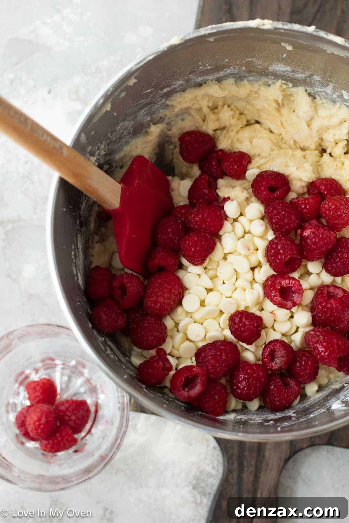 Sweet Raspberry White Chocolate Delights 4 Muffin batter with raspberries and white chocolate chips.