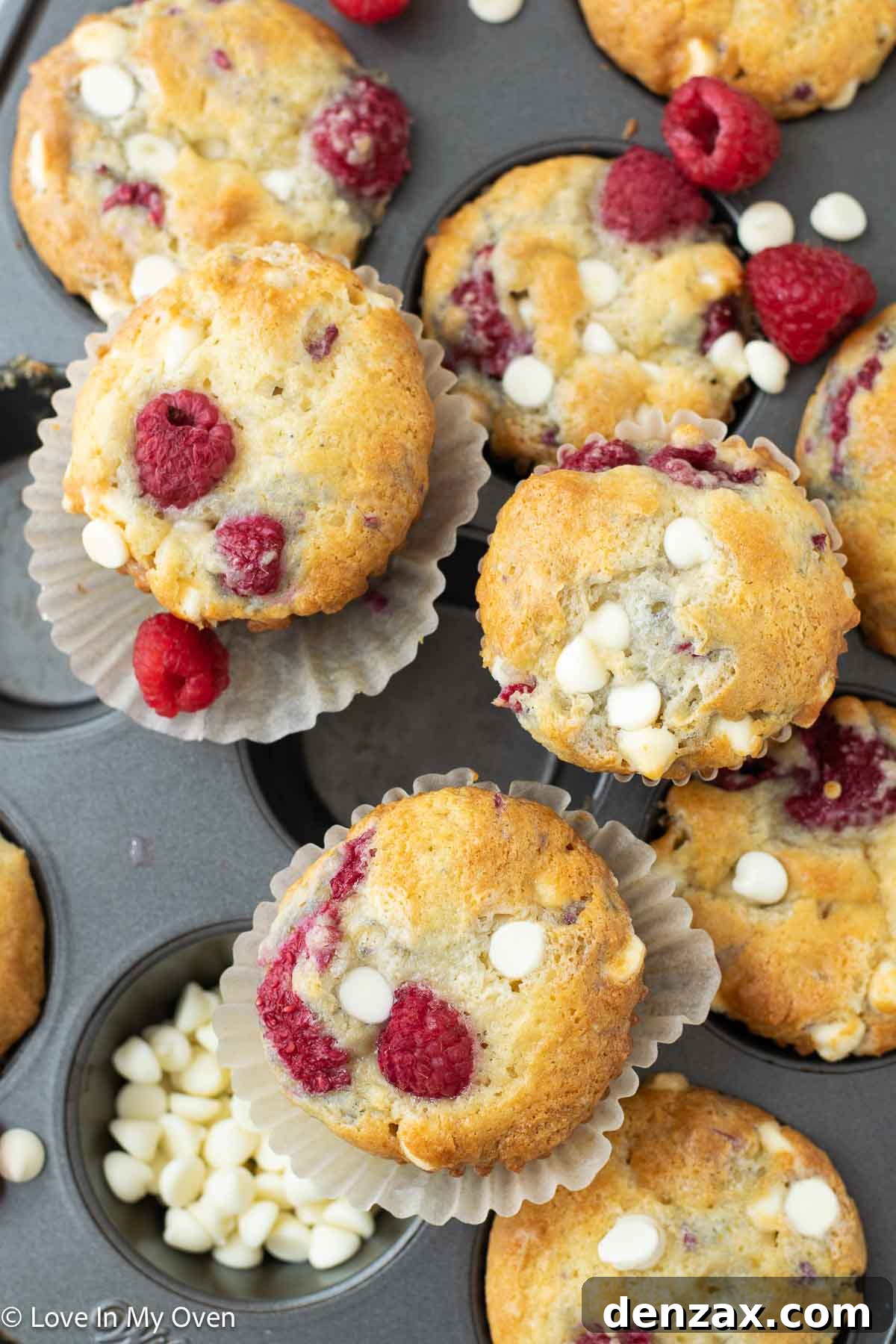 Sweet Raspberry White Chocolate Delights 6 Close-up of a baked raspberry white chocolate muffin, showing the fluffy texture and fruit.