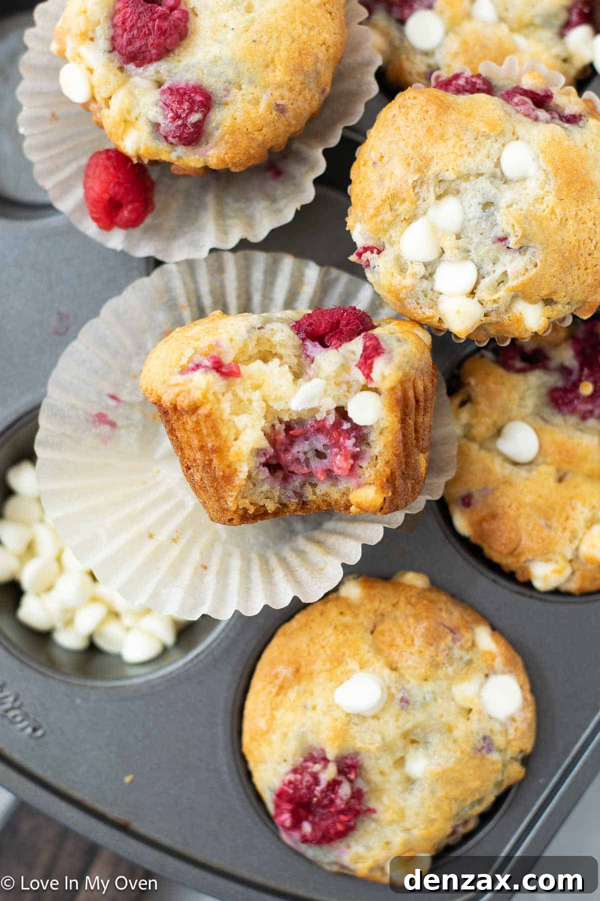 Sweet Raspberry White Chocolate Delights 8 A large batch of raspberry white chocolate muffins cooling on a wire rack.