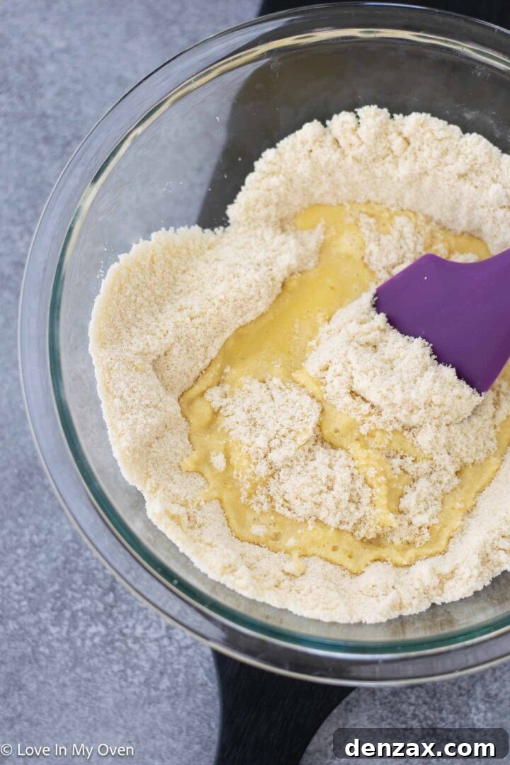 Mixing almond flour and eggs for the bread batter