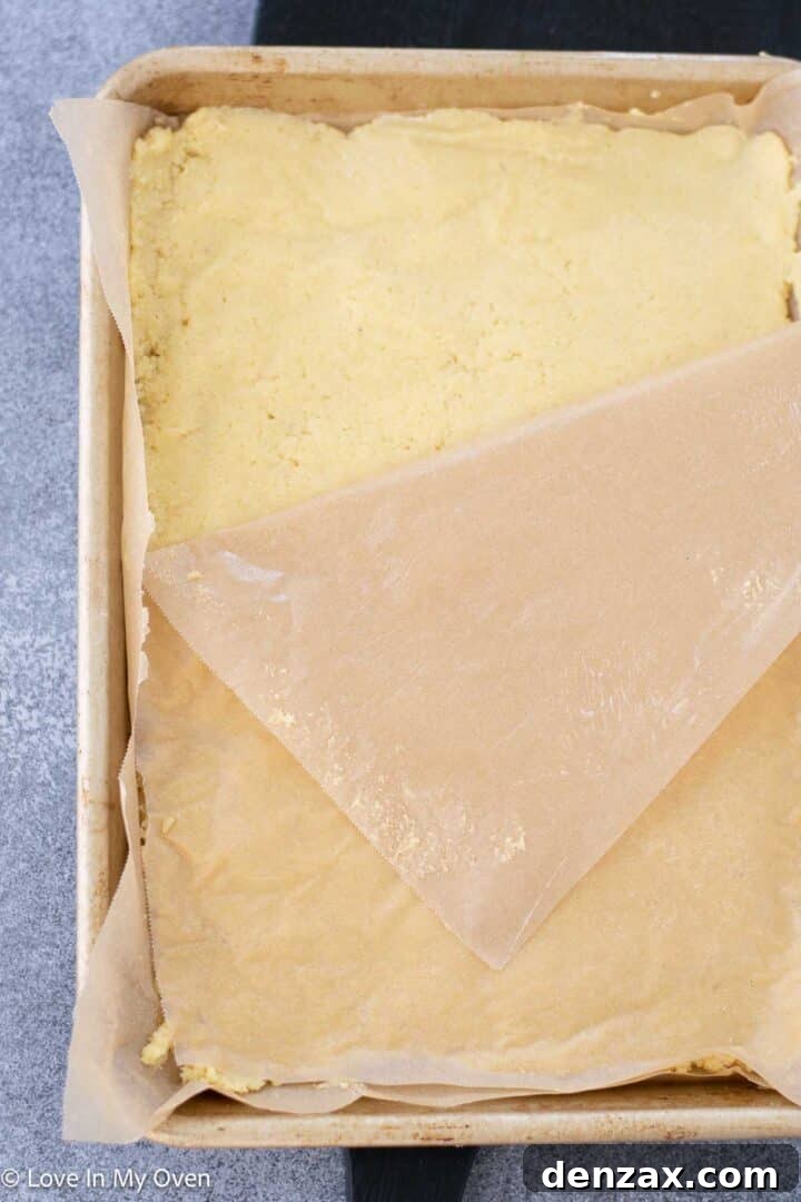 Spreading the almond flour bread batter into the pan