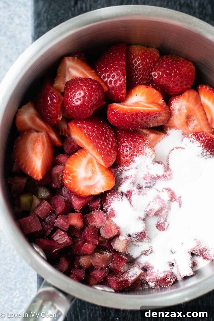 Strawberry rhubarb compote simmering on the stove