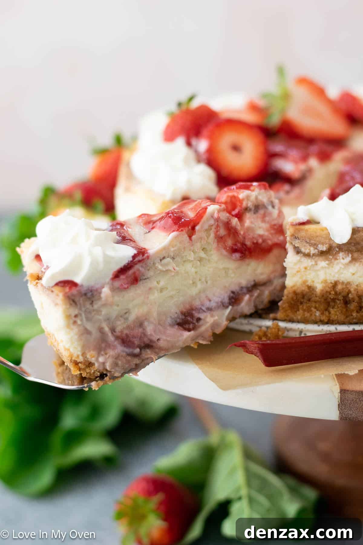 Close-up of a slice of strawberry rhubarb cheesecake showing texture
