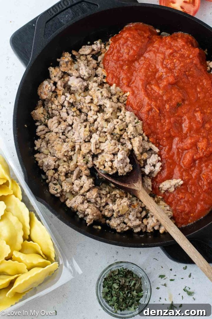 Step-by-step image of layering ravioli and sauce