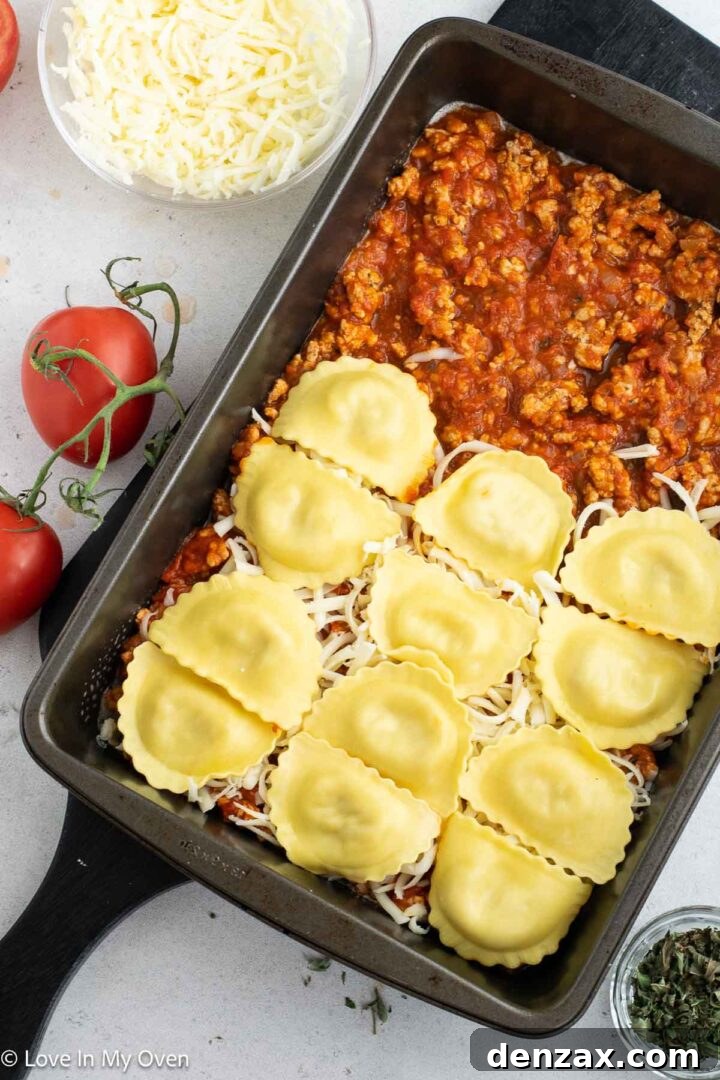 Layering mozzarella cheese in a ravioli bake