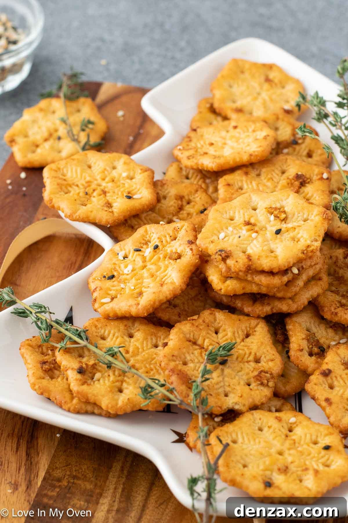 hands reaching for baked ritz crackers