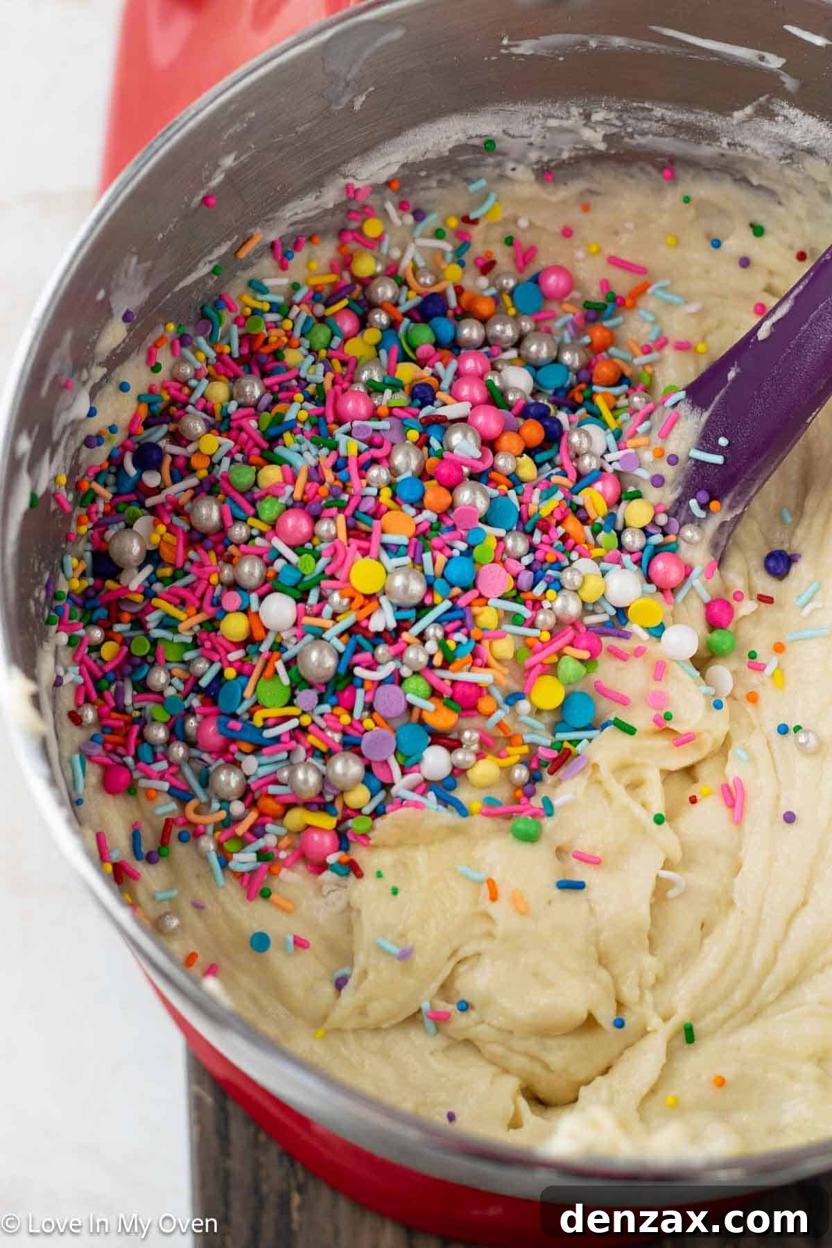 Step-by-step image of cake batter spread on a sheet pan