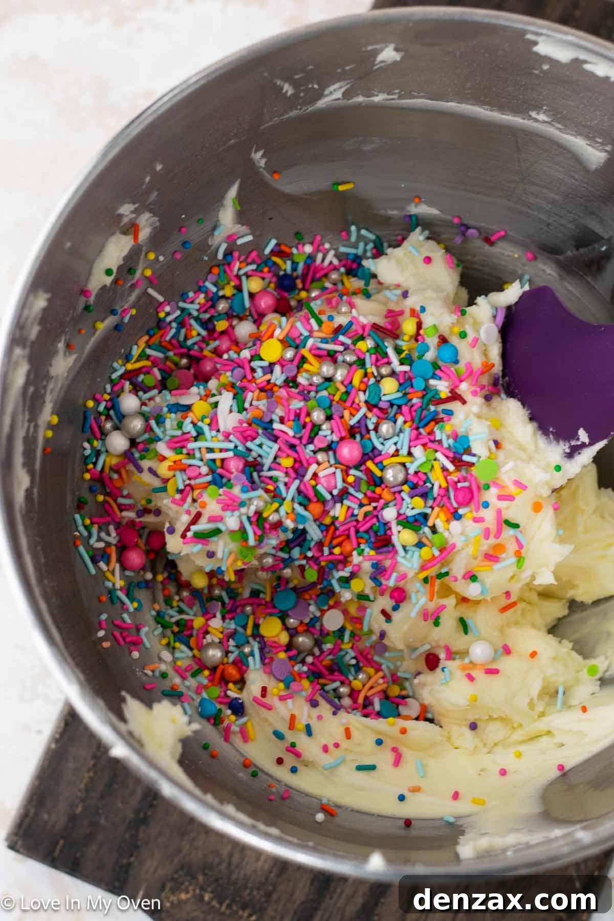 Close-up of vanilla sprinkle buttercream in a mixing bowl