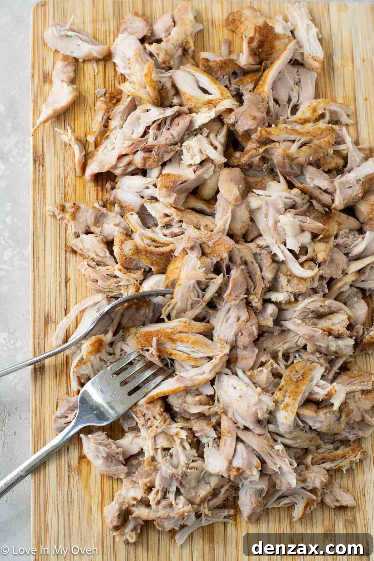 Finished pulled chicken in a Dutch oven
