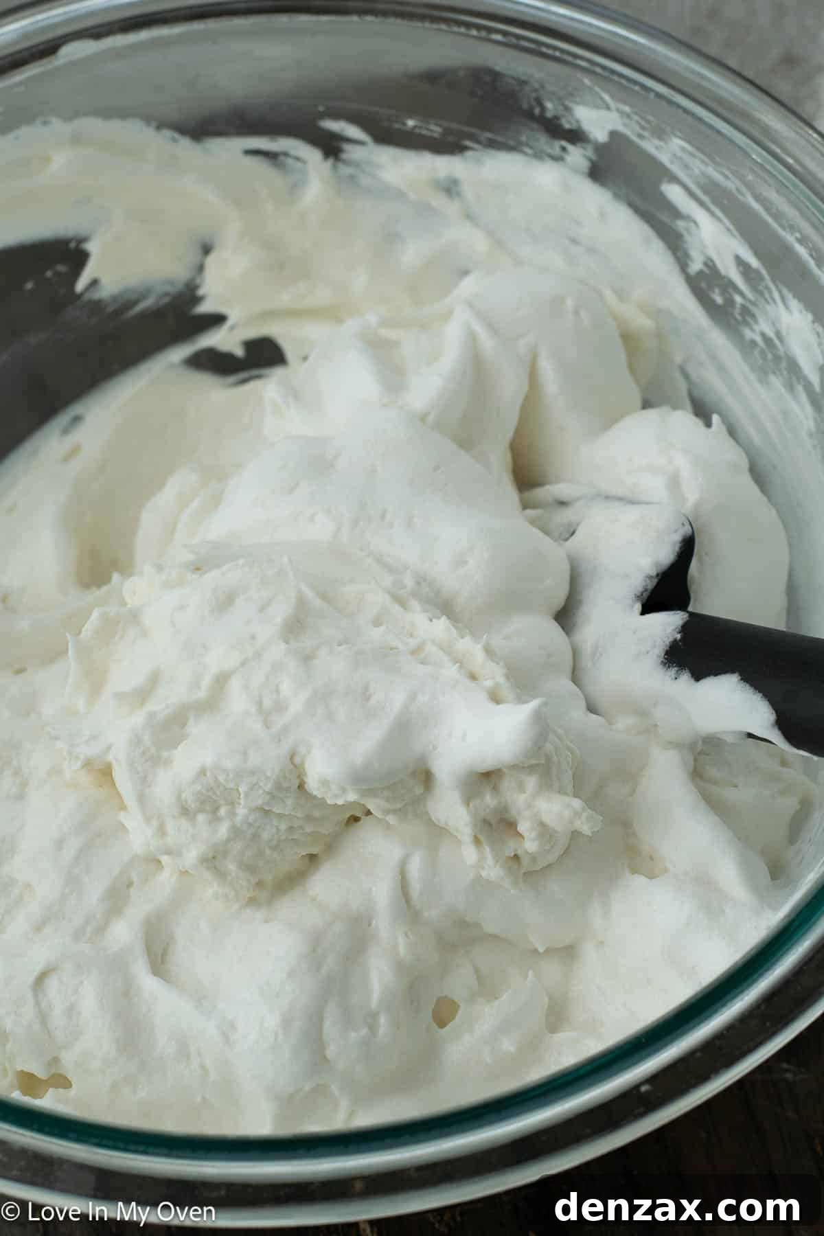 Stiffly whipped heavy cream in a separate mixing bowl