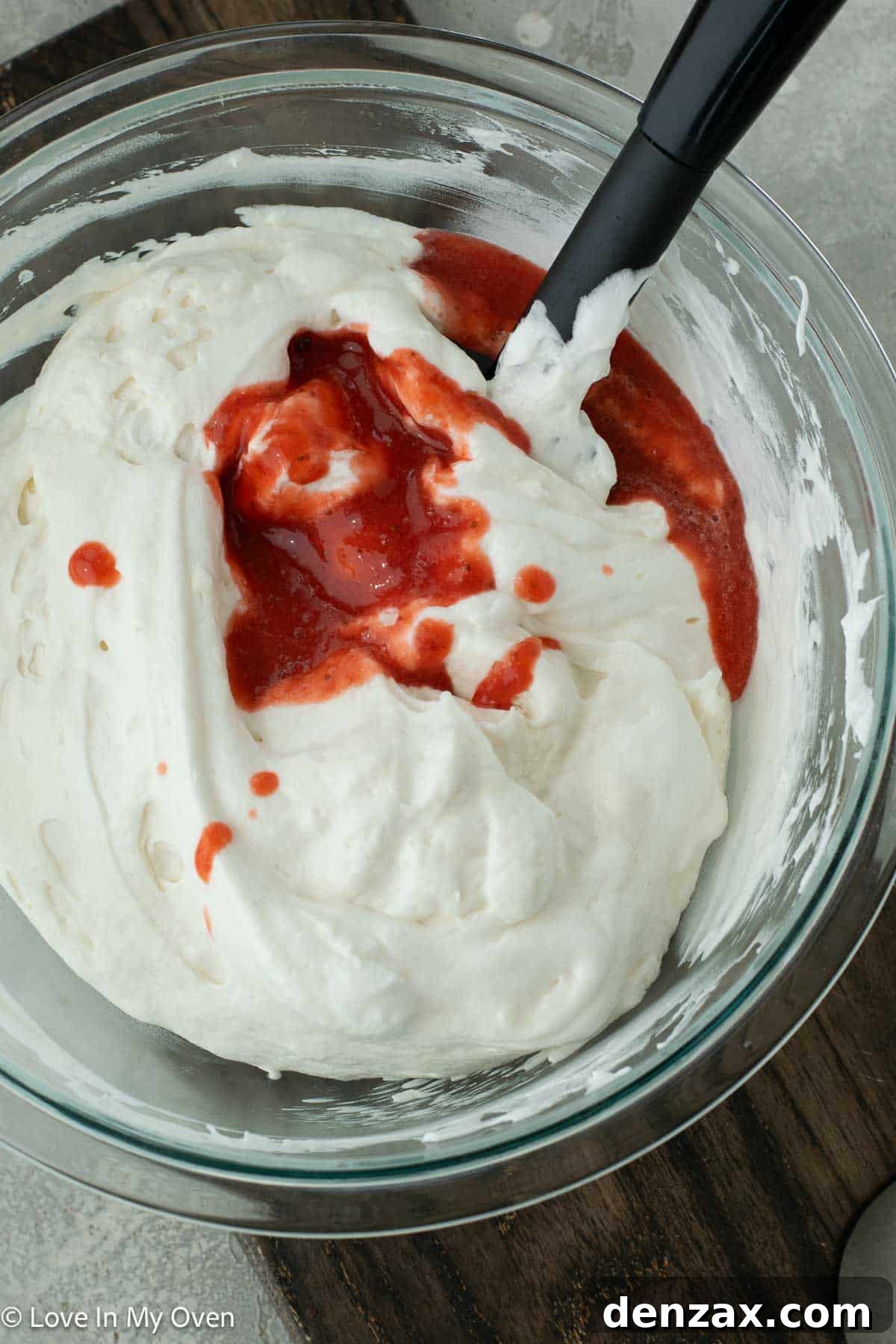 Meringue and whipped cream being gently folded together