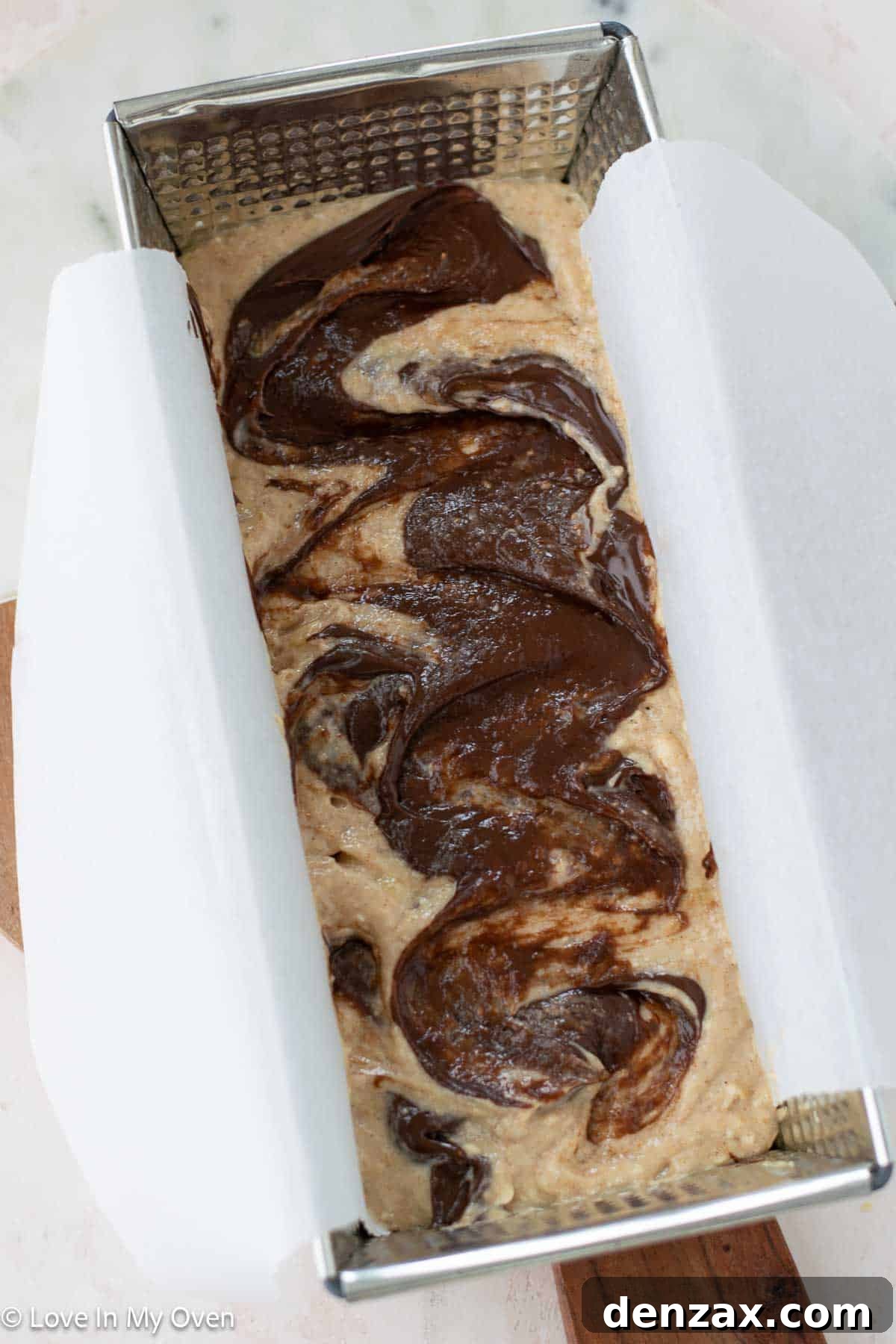 Golden-brown Nutella Banana Bread cooling in its loaf pan after baking