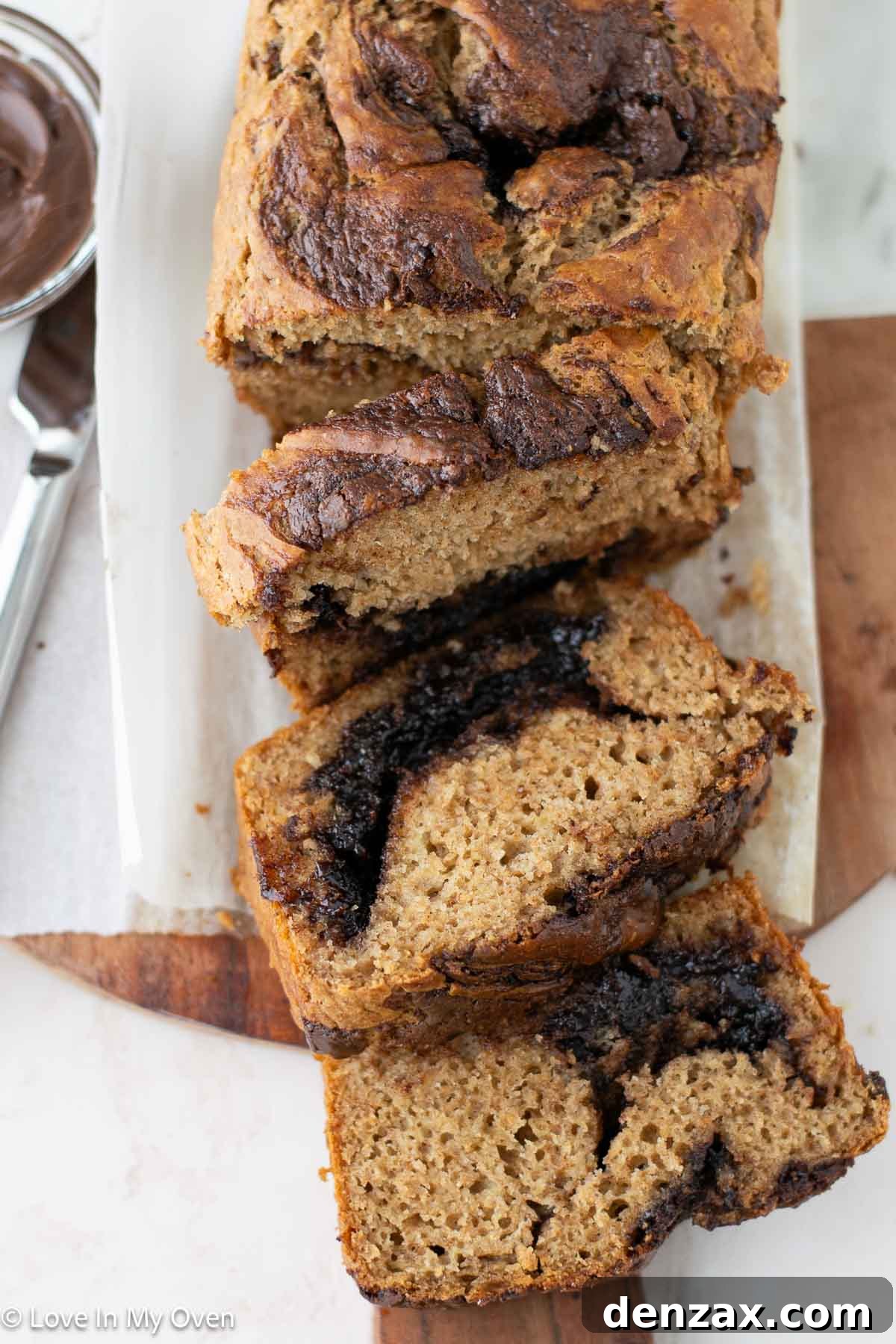 Slices of Nutella Banana Bread artfully arranged on a serving plate