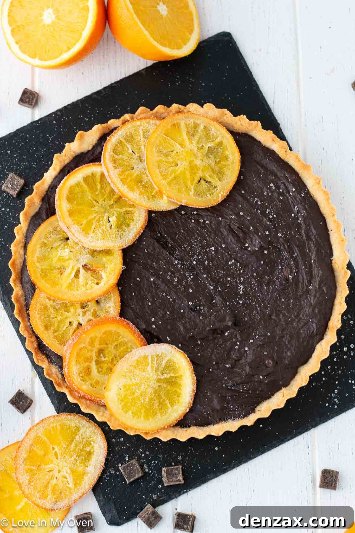 Decadent chocolate orange tart slice with orange zest