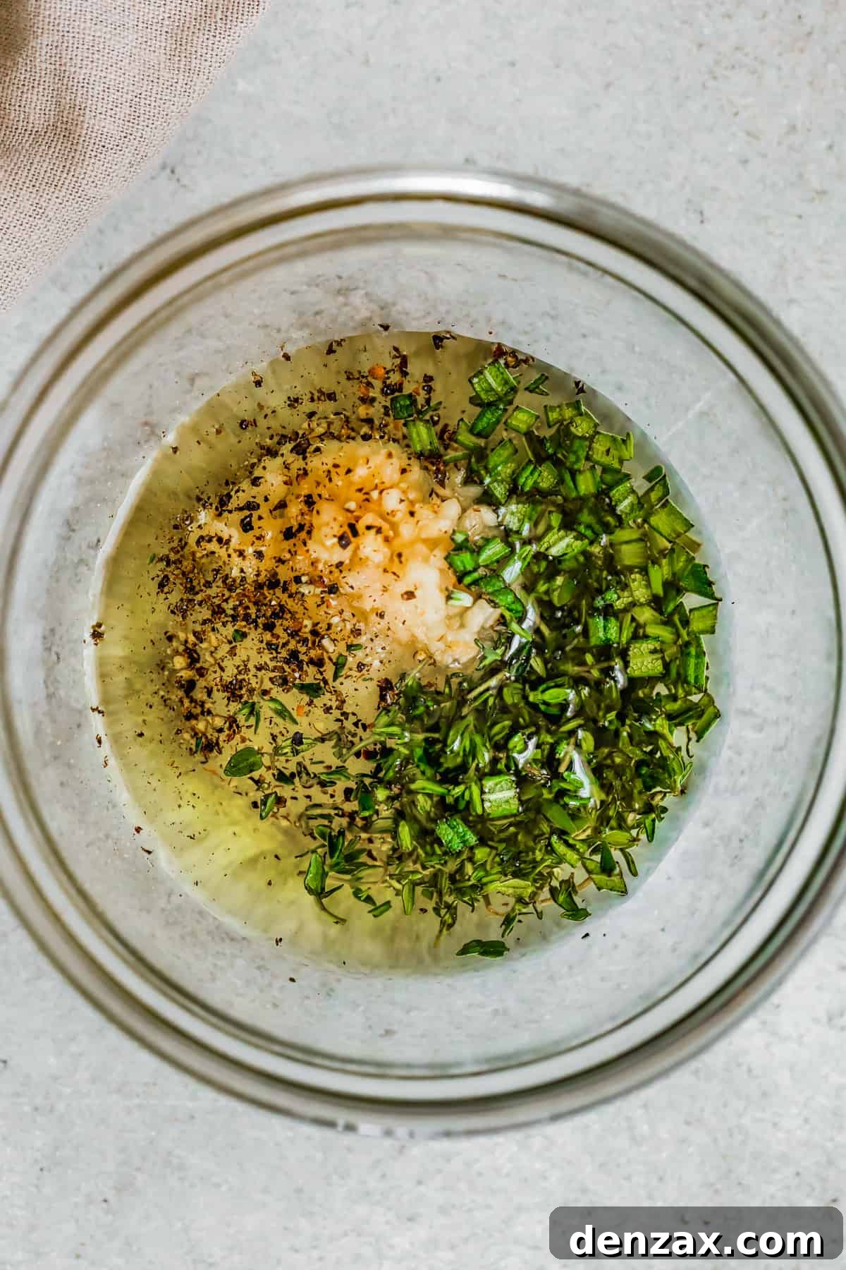 Seasonings and liquids in a mixing bowl.