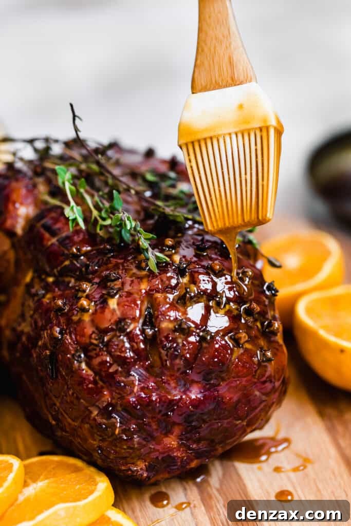 Brown Sugar Glaze Being Poured Over a Fresh-From-the-Oven Ham, creating a shiny, delectable finish.