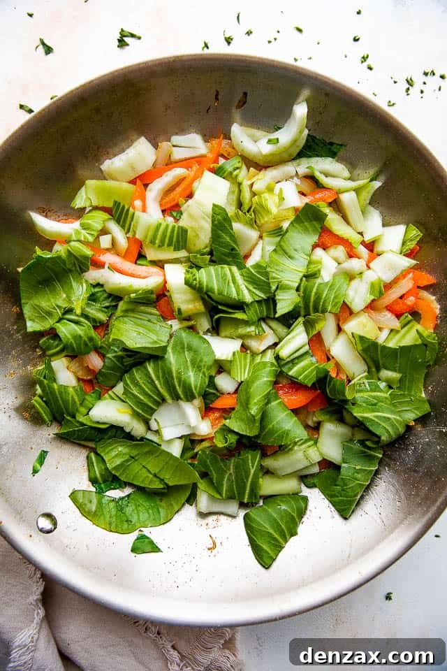 Glazed Honey Balsamic Beef Stir Fry 4 stir frying bok choy, onions, and bell peppers in a skillet