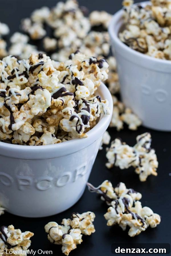 Close-up of a pile of black and white popcorn showing chocolate drizzle
