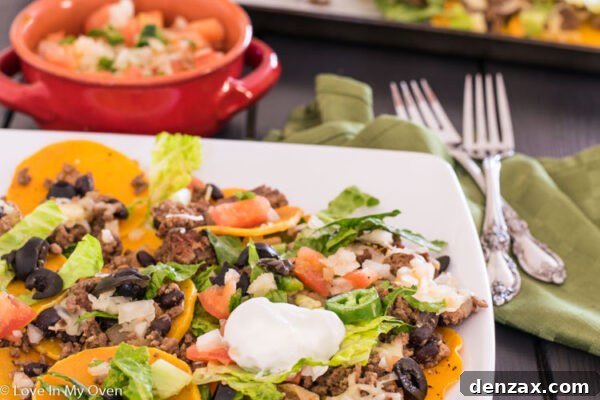 Close-up of a loaded butternut squash nacho with fresh toppings