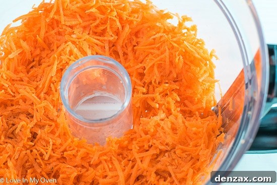 Freshly shredded carrots, a key ingredient for a moist carrot cake.