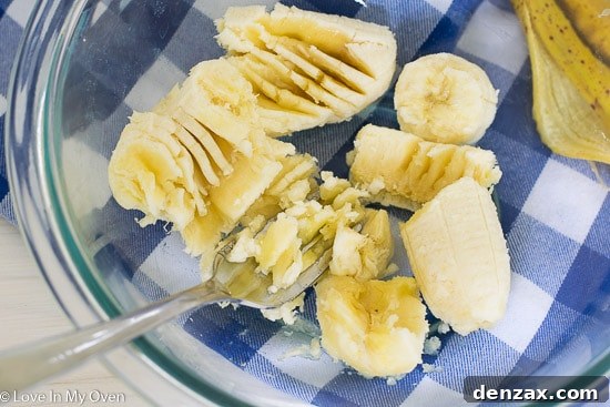 Mashing a ripe banana in a bowl, the first step for two-ingredient pancakes