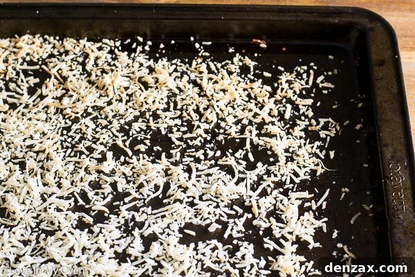 Food processor blending cashews, pecans, and dates for the coconut nest base