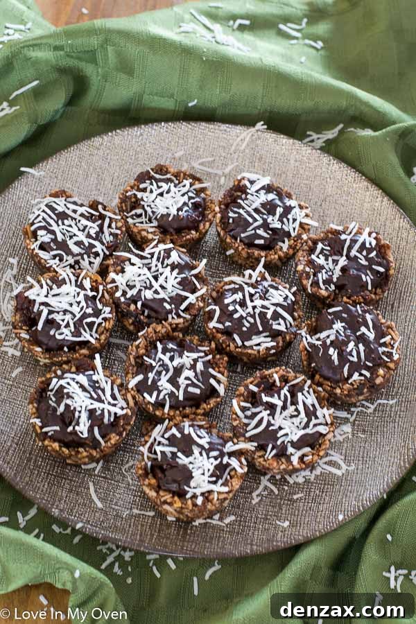 Close-up of a filled healthy chocolate coconut basket, highlighting the creamy ganache and shredded coconut topping