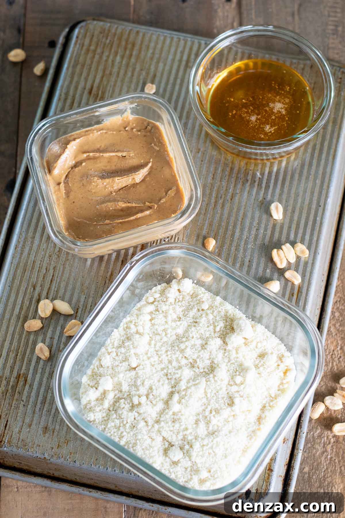 Close-up of the three ingredients: almond flour, peanut butter, and honey
