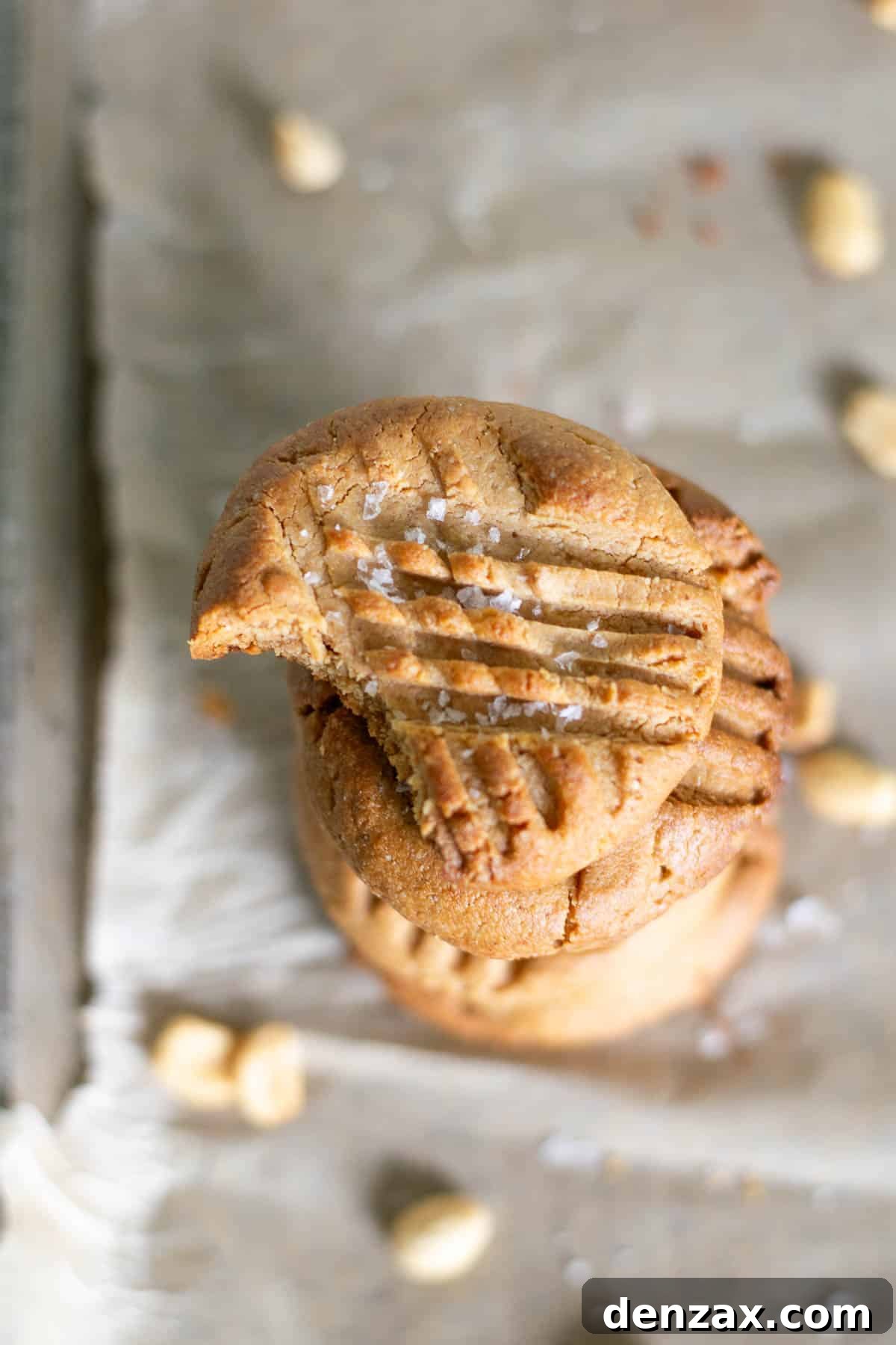 A plate of 3 ingredient peanut butter cookies with a glass of milk