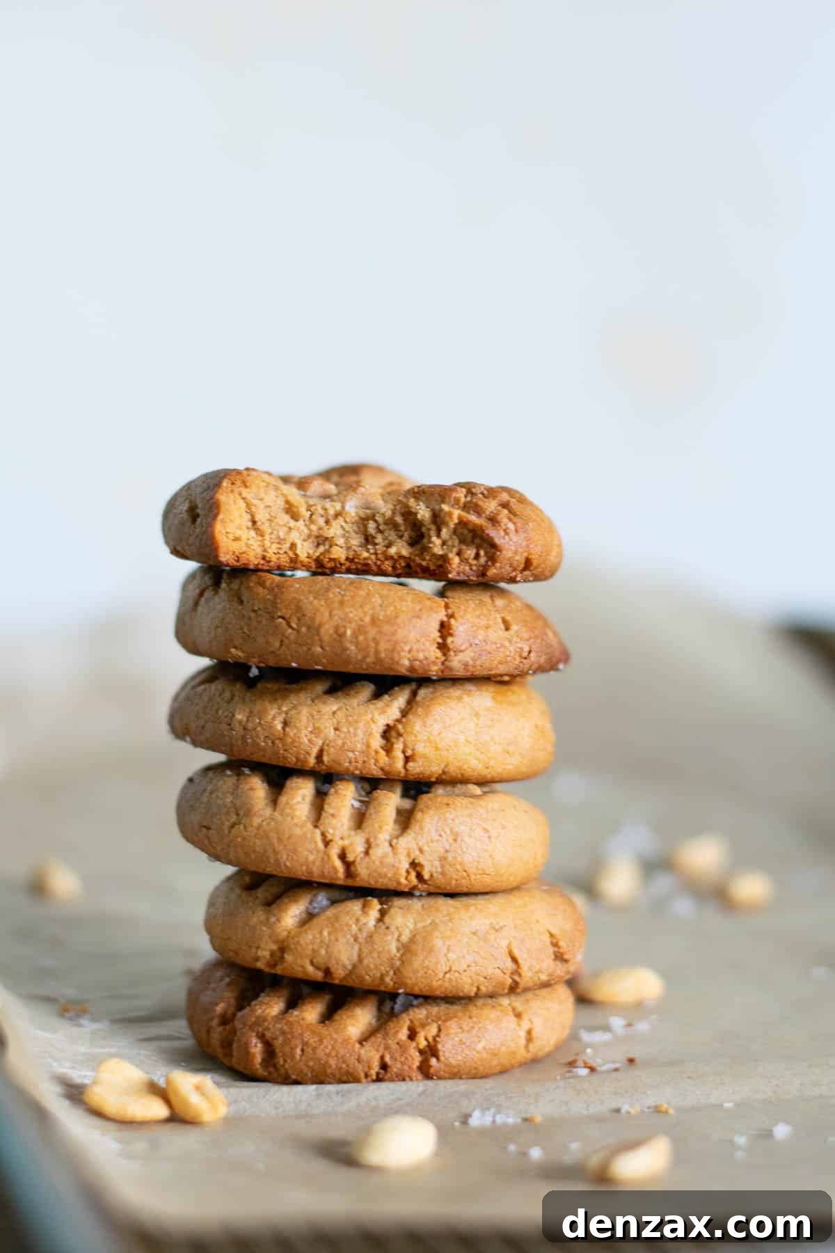 Stack of 3 ingredient peanut butter cookies on a rustic background