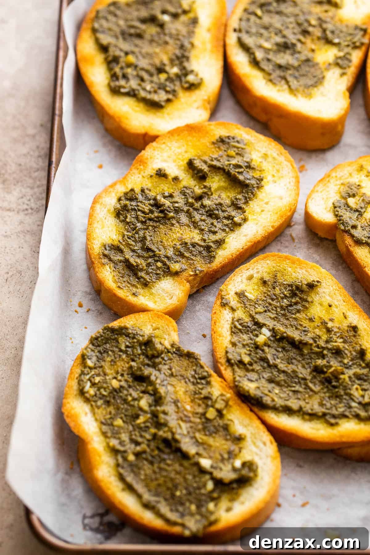 toasted bread slices topped with basil pesto