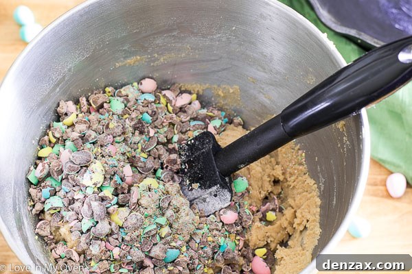 Mixing cookie dough in a stand mixer, a crucial step for a giant mini egg skillet cookie